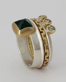 Three band 'Stacking Ring' with pyramid green Tourmaline and three green Sapphires